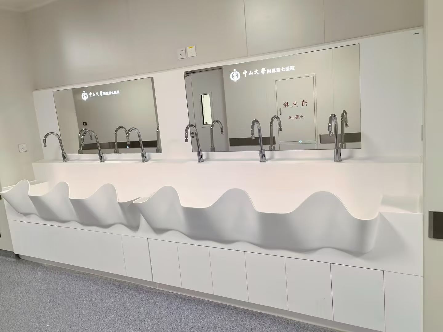 Modern multi-basin corian solid surface surgical sink with unique design.