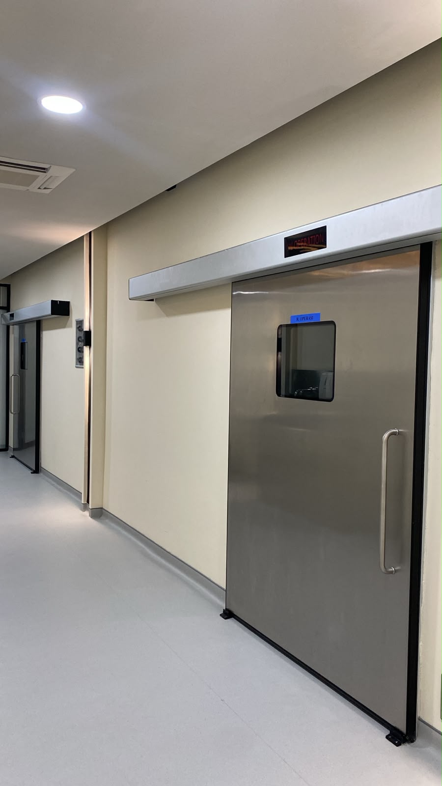 ICARELIFE hermetic door detail with vision panel at Bali 911 Dental Clinic Indonesia