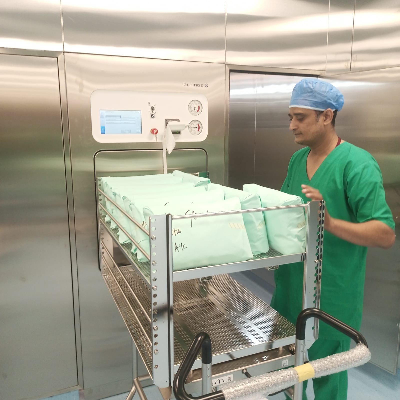 CSSD staff working inside the completed SIUT sterile processing department with modular stainless steel wall panels