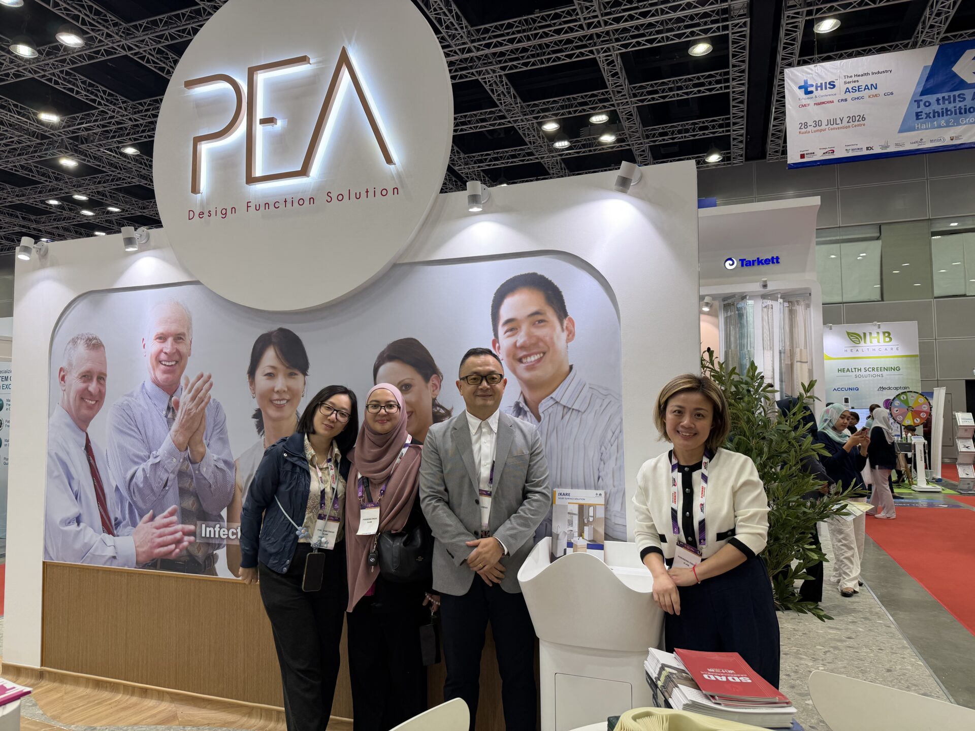 ICARELIFE team with Mrs Wingx of PEA at the joint booth at APHM 2026 in front of Hall 4