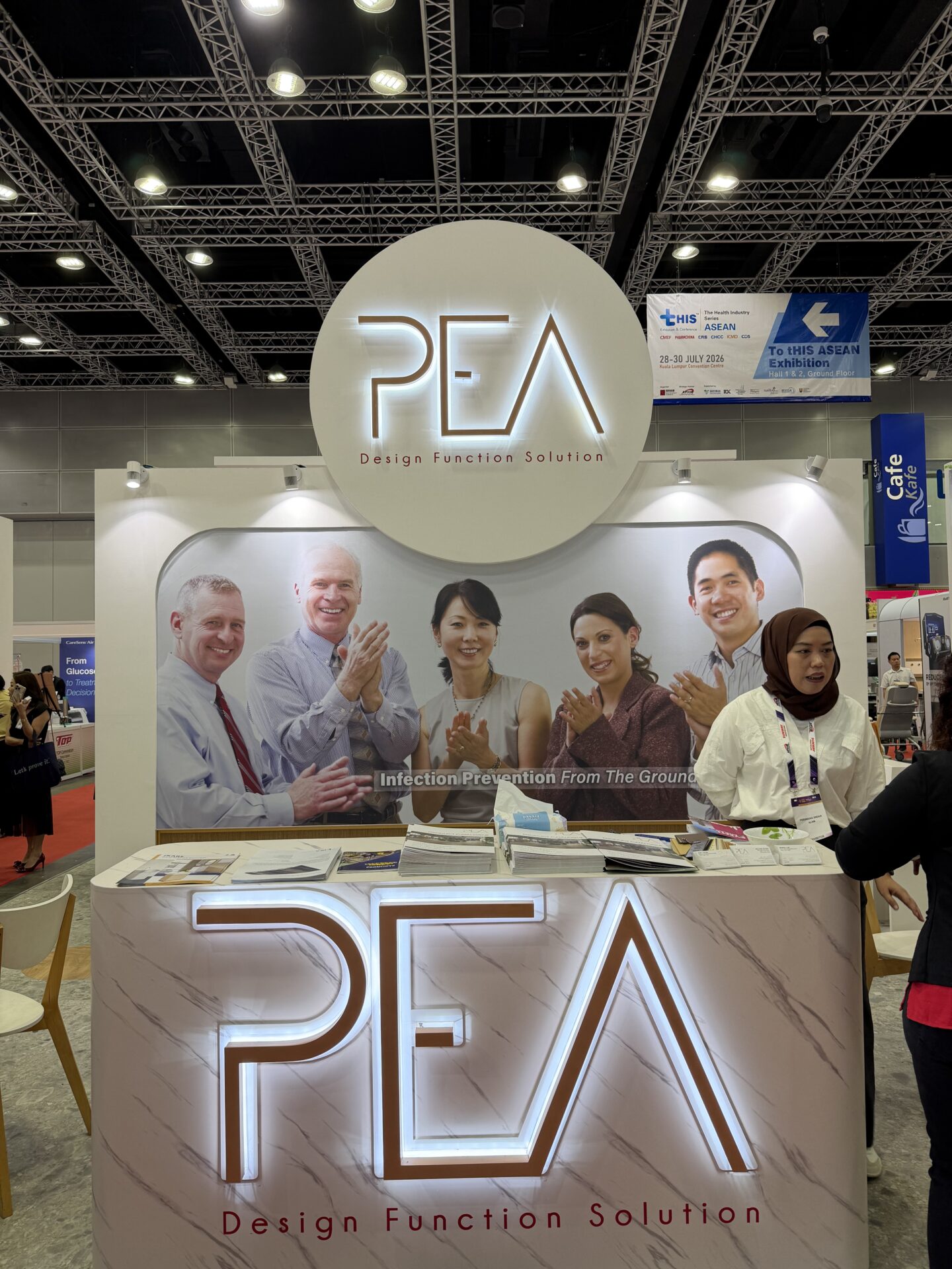 APHM 2026 exhibition booth scene with ICARELIFE and PEA solid surface sink display