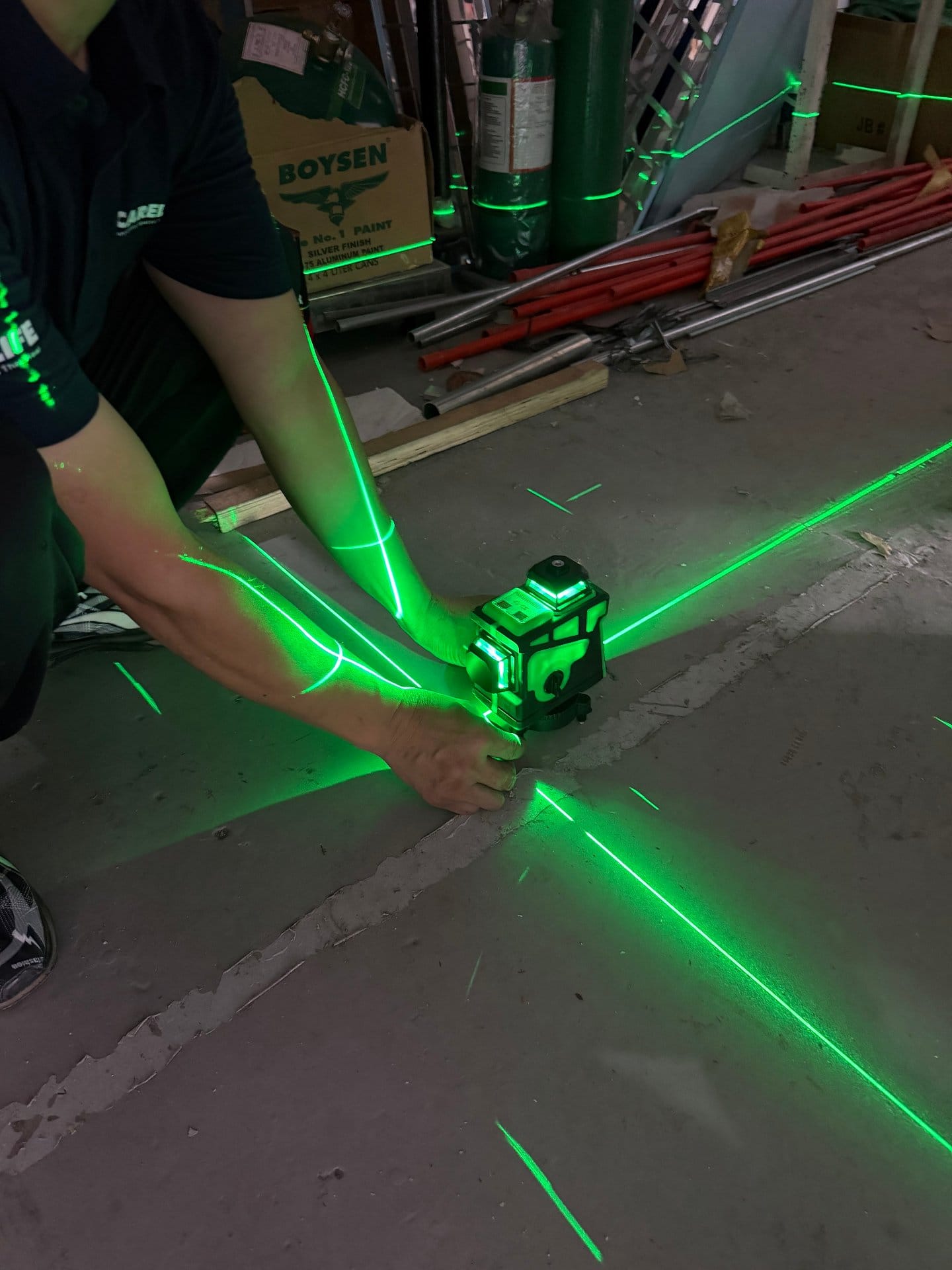 Laser level used for floor leveling check before modular OR installation