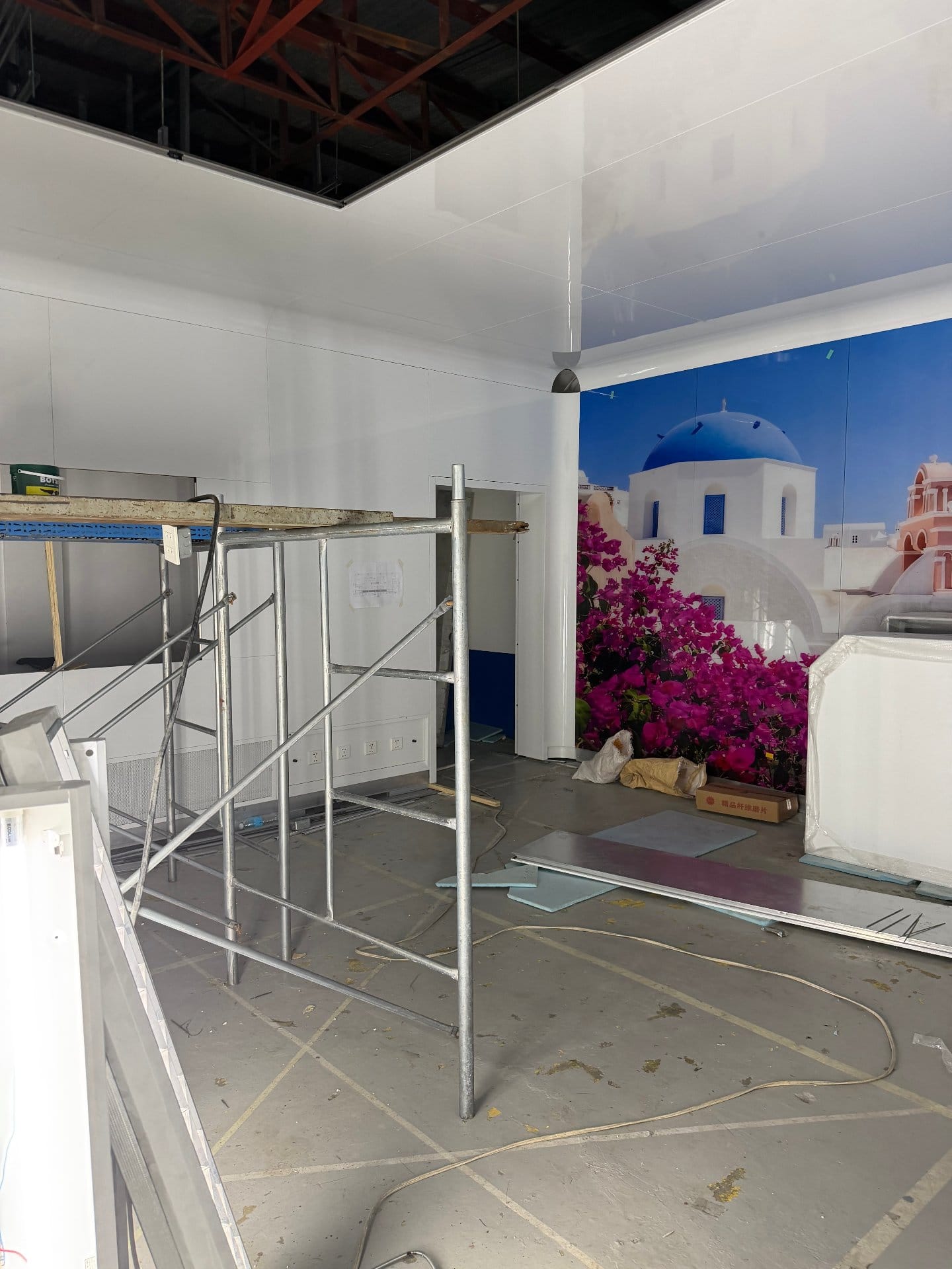 Scaffolding and modular wall framing during showroom OR installation in Manila