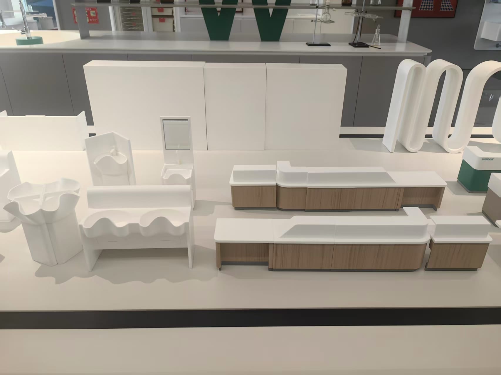 Formed solid surface sample basins, counters and wall panels on display