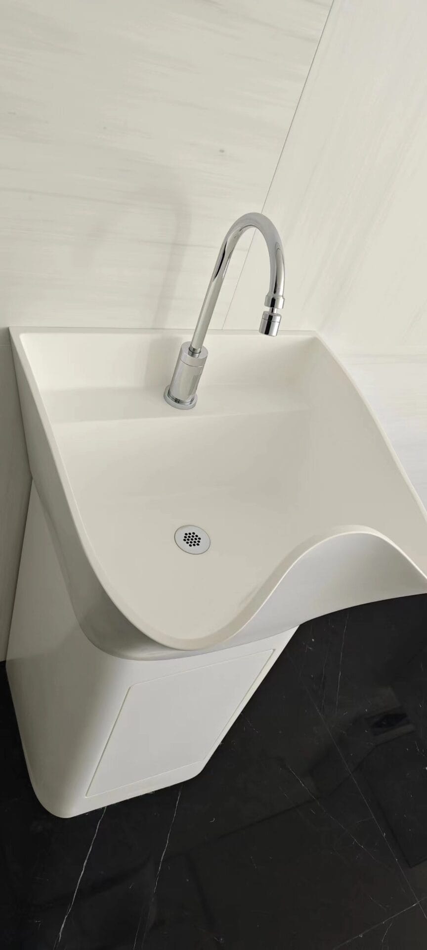 Close-up of a single scrub sink bowl with a gooseneck tap