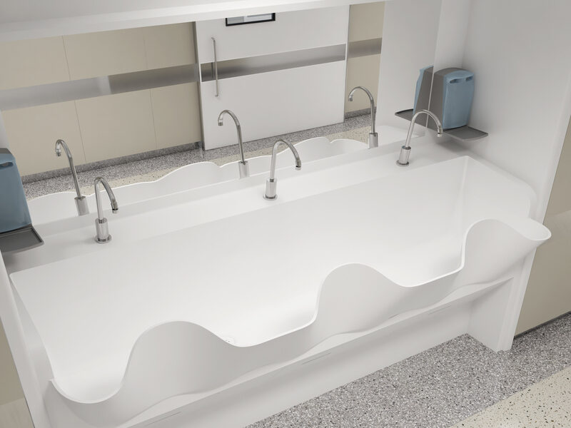 Modern corian surgical sink with multiple faucets in restroom.